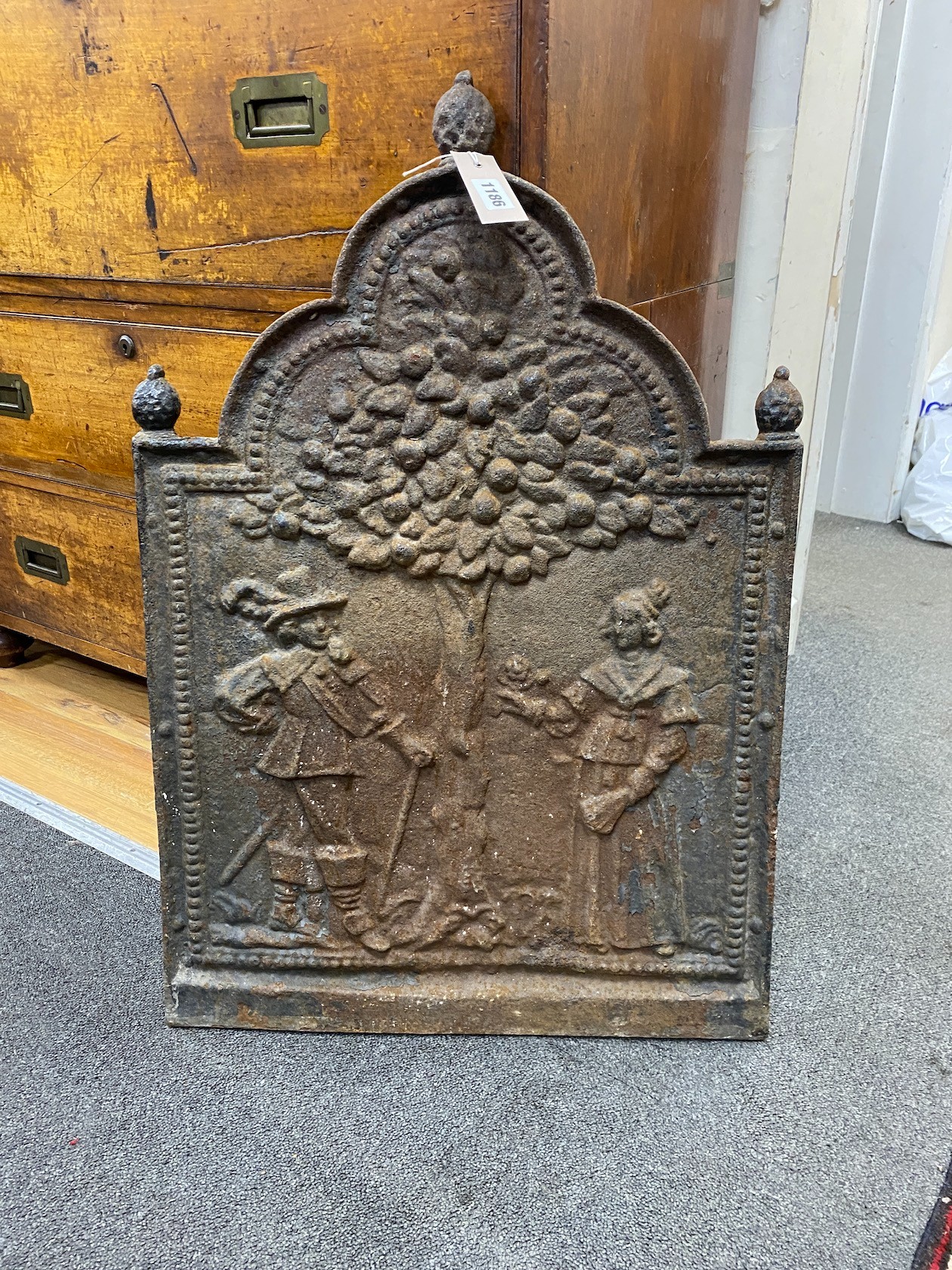 A 19th century cast iron Dutch style fireback, length 51cm, height 76cm
